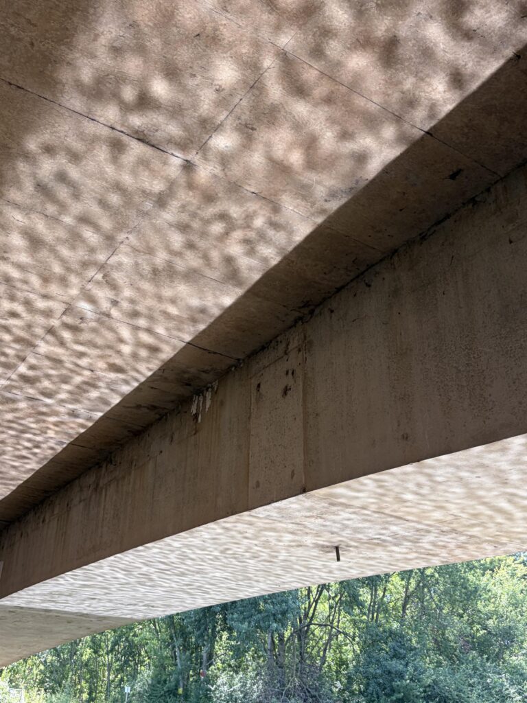Under the bridge.